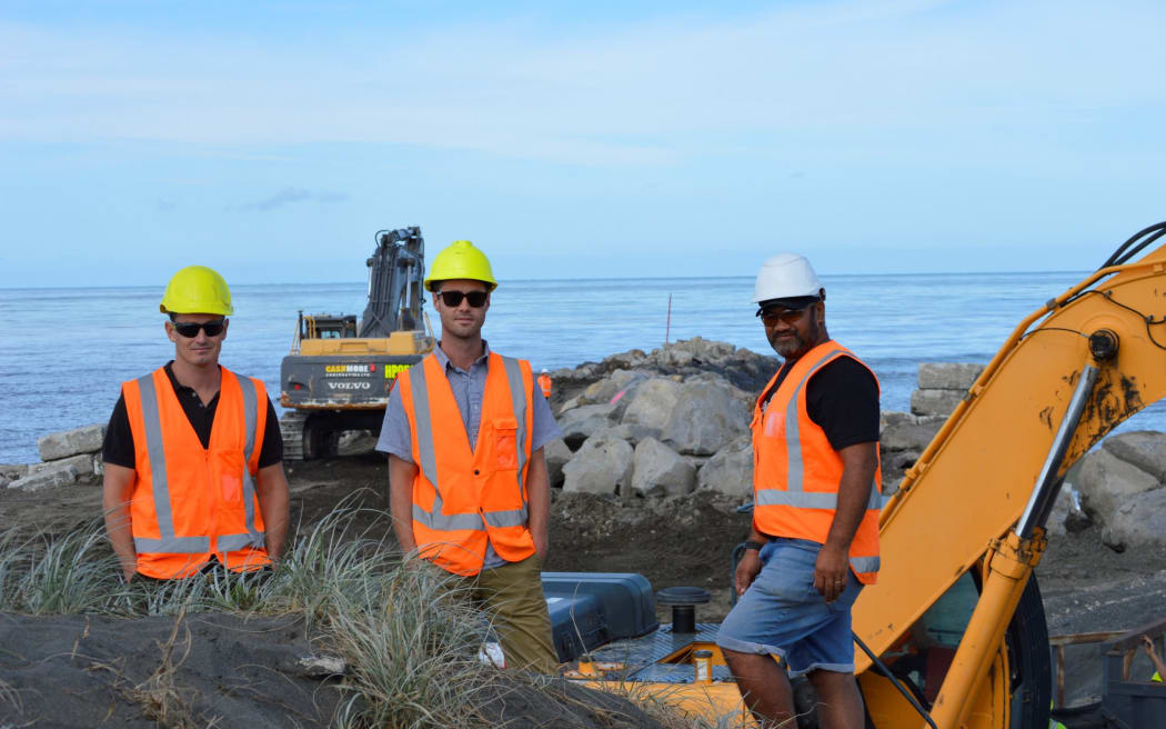 From left, Cashmore Contracting managing director Rob Cashmore, Horizons Regional Council project engineer Dougal Ross, and Kahurangi Simon, of Te Mata Pūau, at works to repair Whanganui's North Mole.