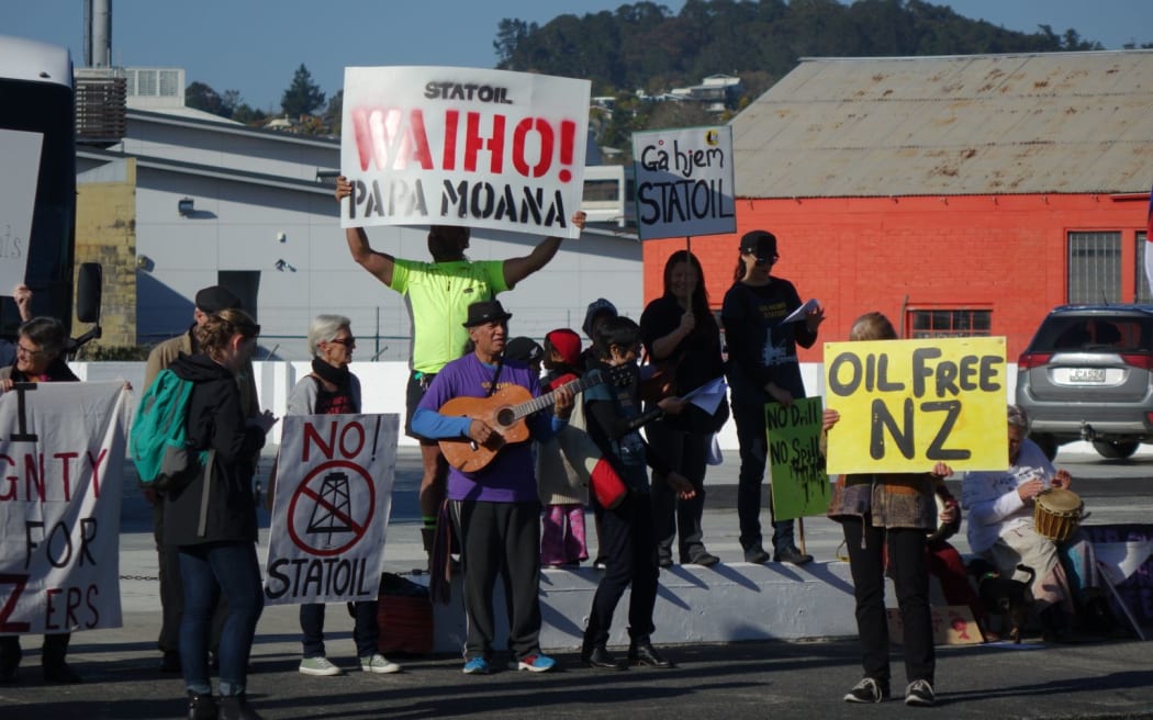 Protestors gather outside the Northland Regional Council building in Whangarei to protest against deep sea oil drilling.