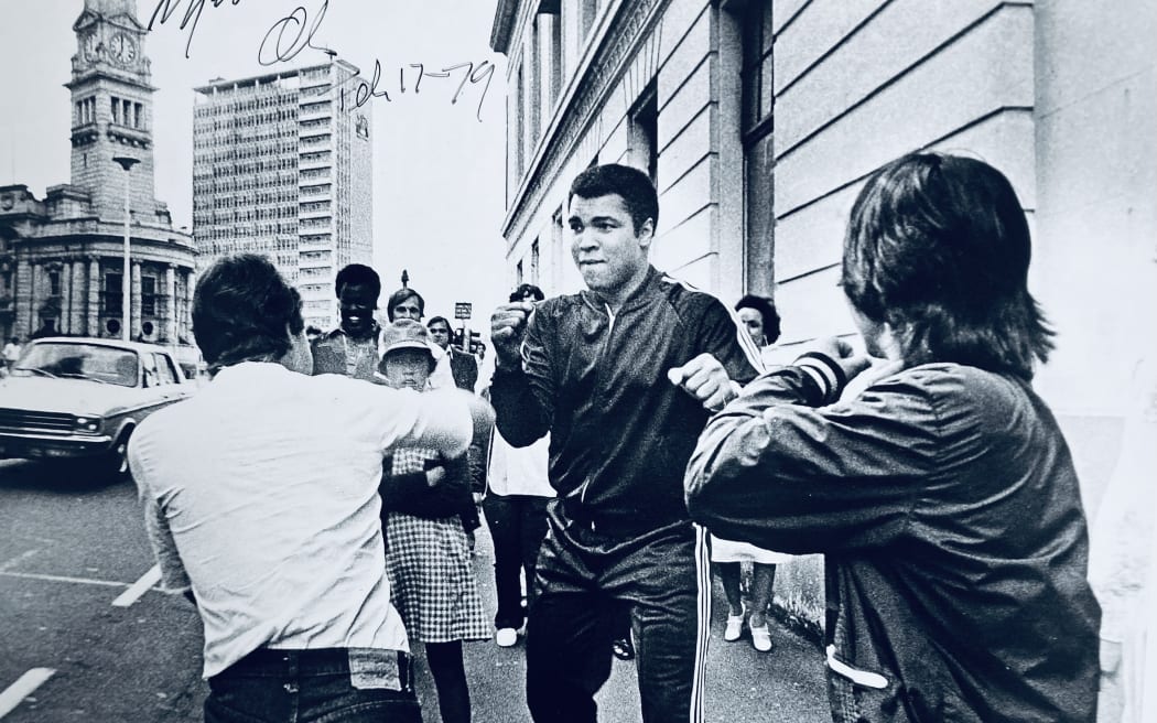 Muhammad Ali sparing himself with a couple of boys on Queen Street in 1979.