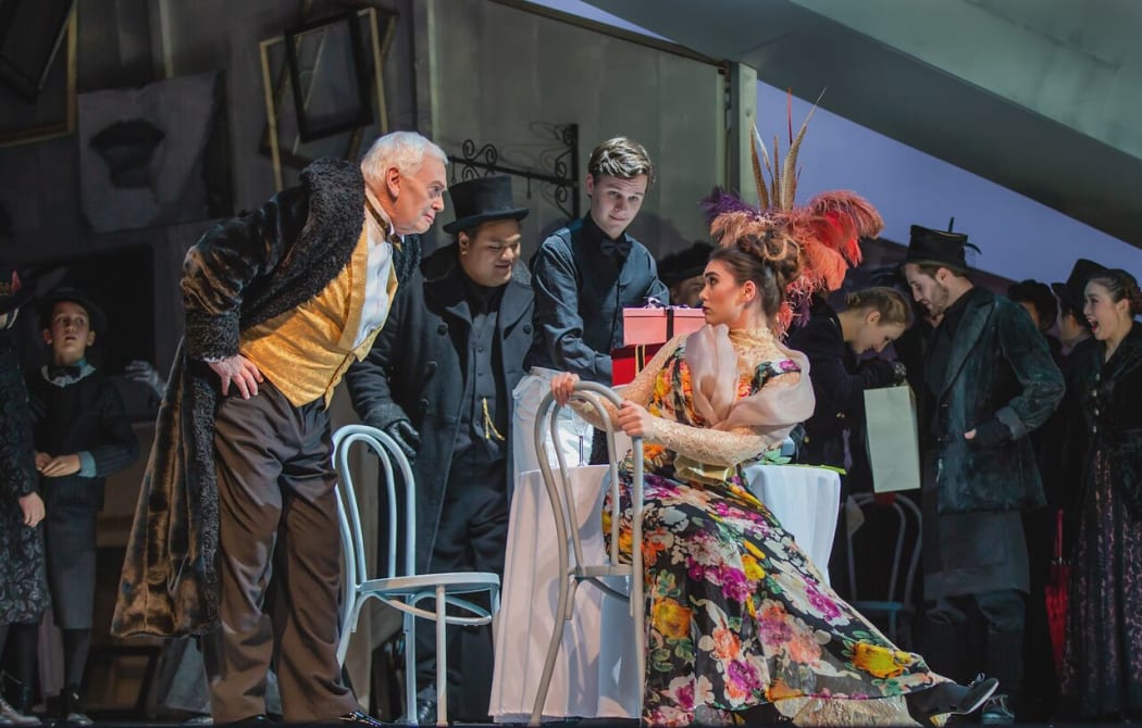 Musetta (Amelia Berry) provokes her sugar daddy Alcindoro (Barry Mora) in La bohème