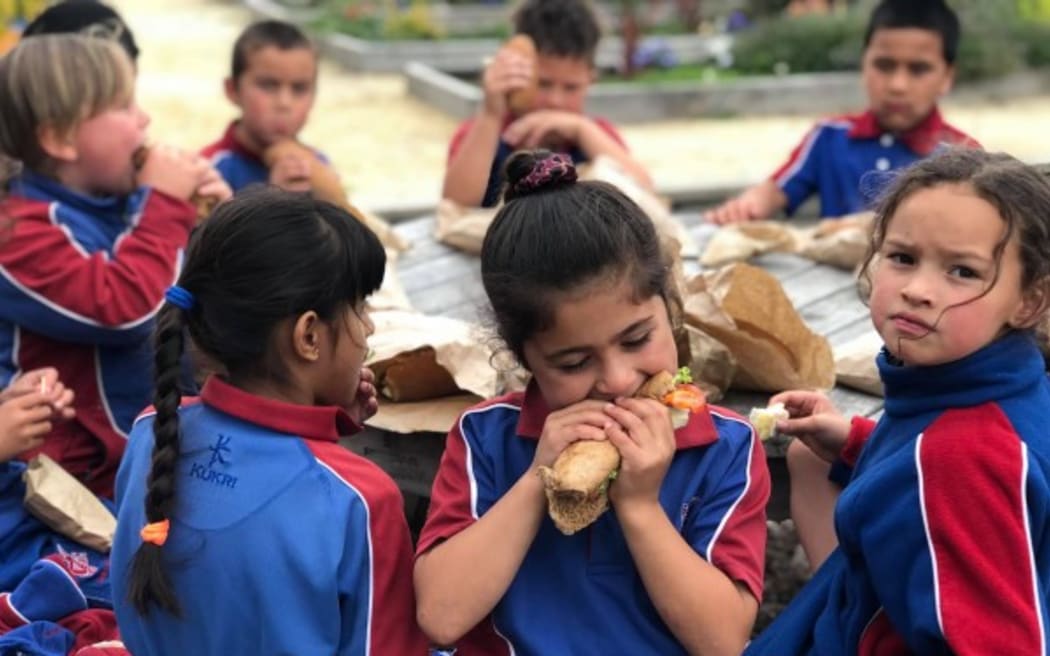 Henry Hill School children tucking into a free school lunch provided through the Ka Ora, Ka Ako Healthy School Lunches Programme