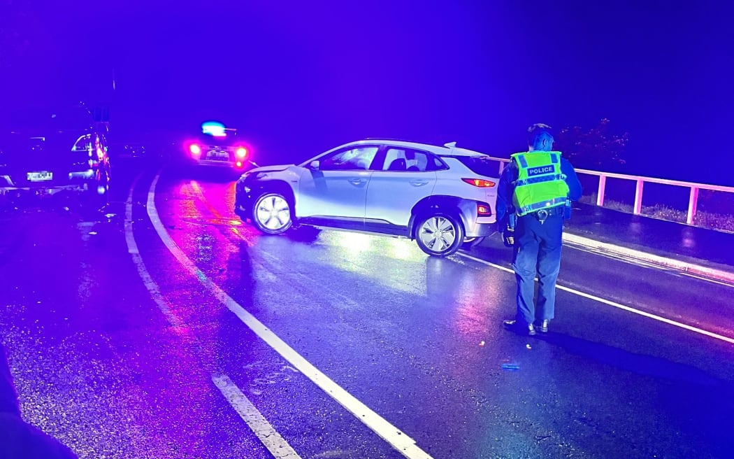 Photos taken on Sunday 23 July 2023 night of a Hyundai Kona - a electric car available to ministers - blocking one lane of a road.