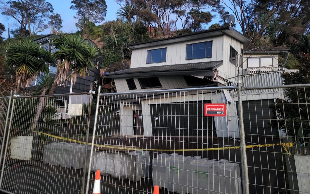 Neighbour 'sad and anxious' as Scenic Drive house risks collapse RNZ News