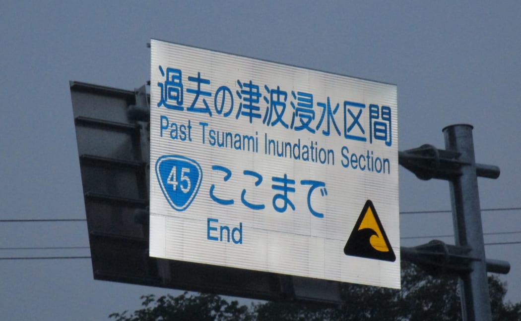 These signs mark the tsunami inundation zone. In most places the waves were at least 10 metres but in some they were 16 metres high.