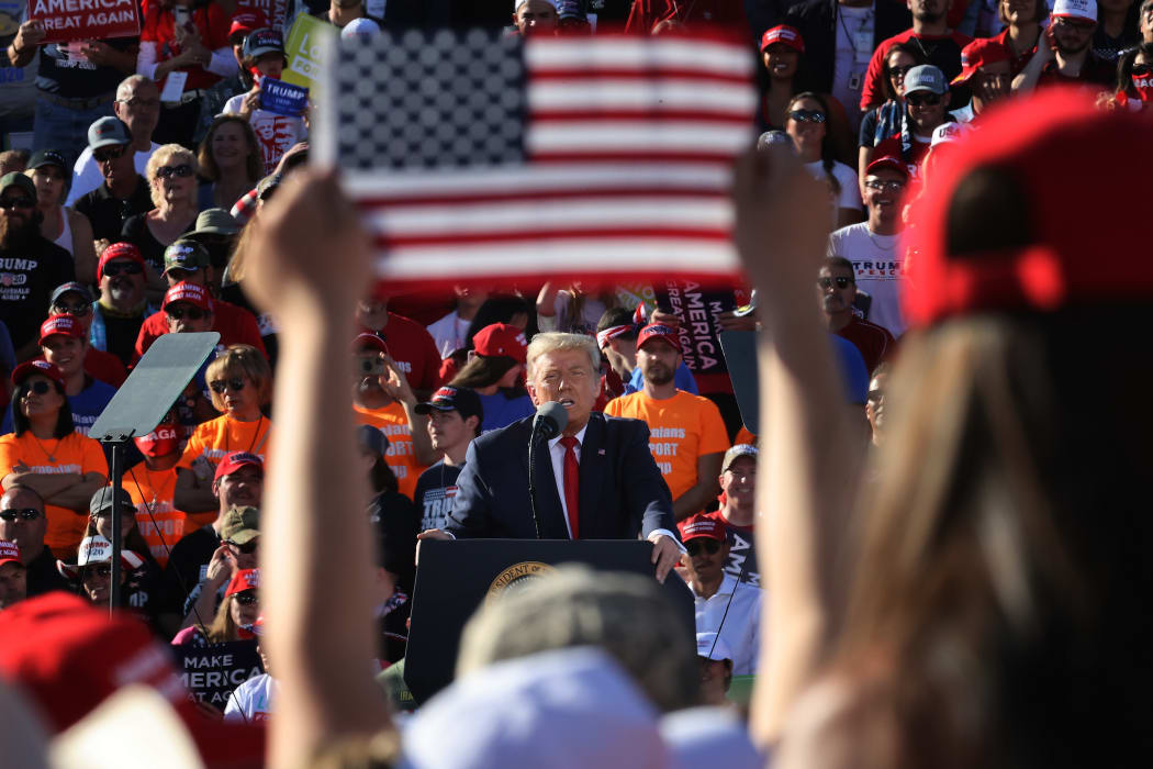 US President Donald Trump addresses thousands of supporters during a campaign rally at Phoenix Goodyear Airport October 28, 2020.