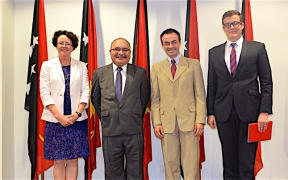 PNG prime minister Peter O'Neill (second from left) meets with World Bank officials, from left: Anne Tully (Country Program Coordinator); Michael Kerf (Country Director); and Andrew Cooper (Senior Operations Officer)