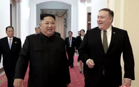 North Korean leader Kim Jong Un, center left, and US Secretary of State Mike Pompeo walk together before their meeting in Pyongyang, North Korea.