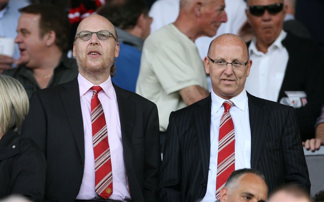 Manchester United owners and directors Avram Glazer (L) and brother Joel.