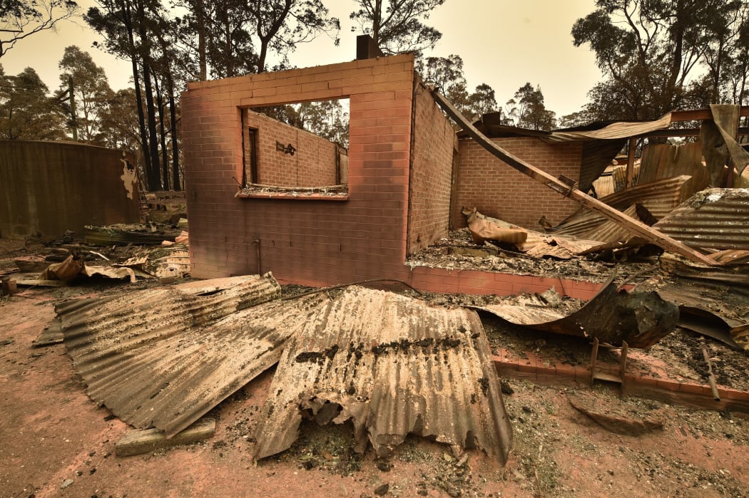 A house destroyed by a bushfire outside Batemans Bay in New South Wales on 2 January, 2020. Smoke from wide ranging fierce bushfires reached as far away as Brazil.