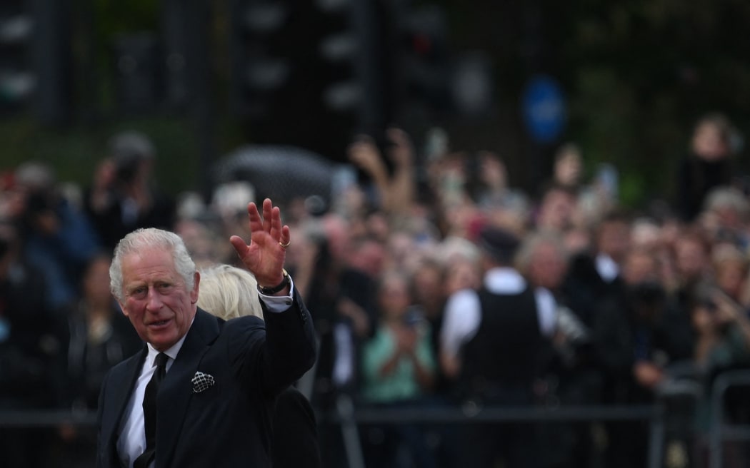 Britain's King Charles III and Britain's Camilla, Queen Consort greet the crowd upon their arrival Buckingham Palace in London, on September 9, 2022, a day after Queen Elizabeth II died at the age of 96.