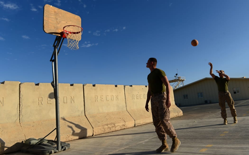 US Marines play basketball as British and US troops prepare to withdraw from the Camp Bastion-Leatherneck complex in Helmand province.