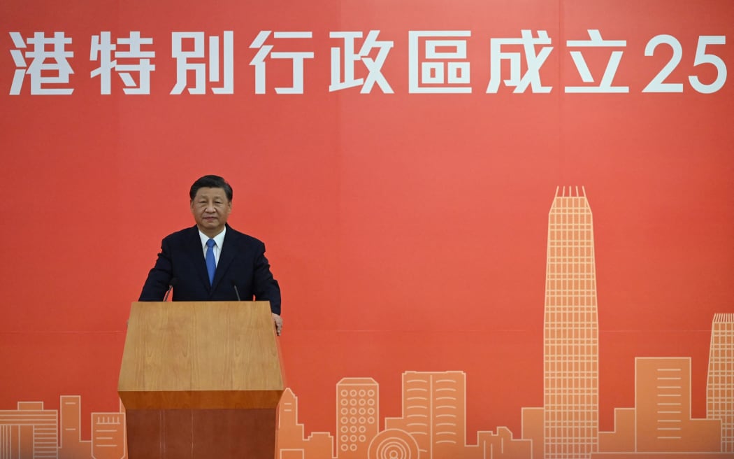 China's President Xi Jinping speaks following his arrival via high-speed rail across the border in Hong Kong on June 30, 2022, for celebrations marking the 25th anniversary of the city's handover from Britain to China.