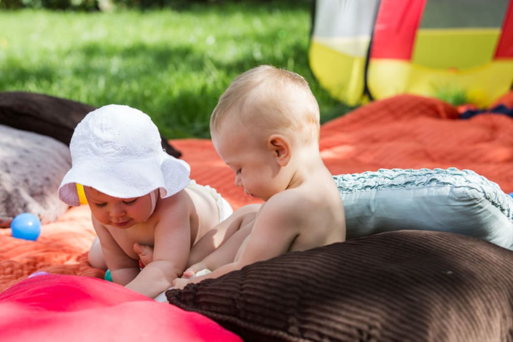 babies playing together (stock photo)