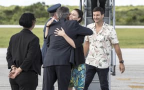 Prime Minister Jacinda Ardern is greeted by her father Ross Ardern, the High Commissioner.
