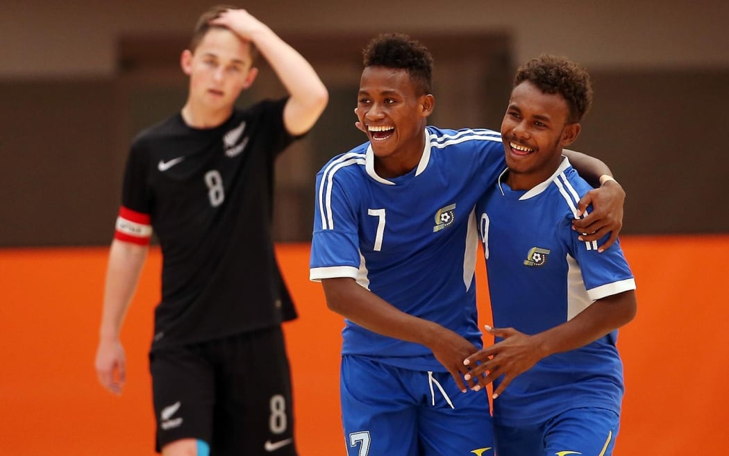 Raphael Le'ai (C) celebrates one of his 12 goals on day one of the OFC Youth Futsal Tournament in Auckland.