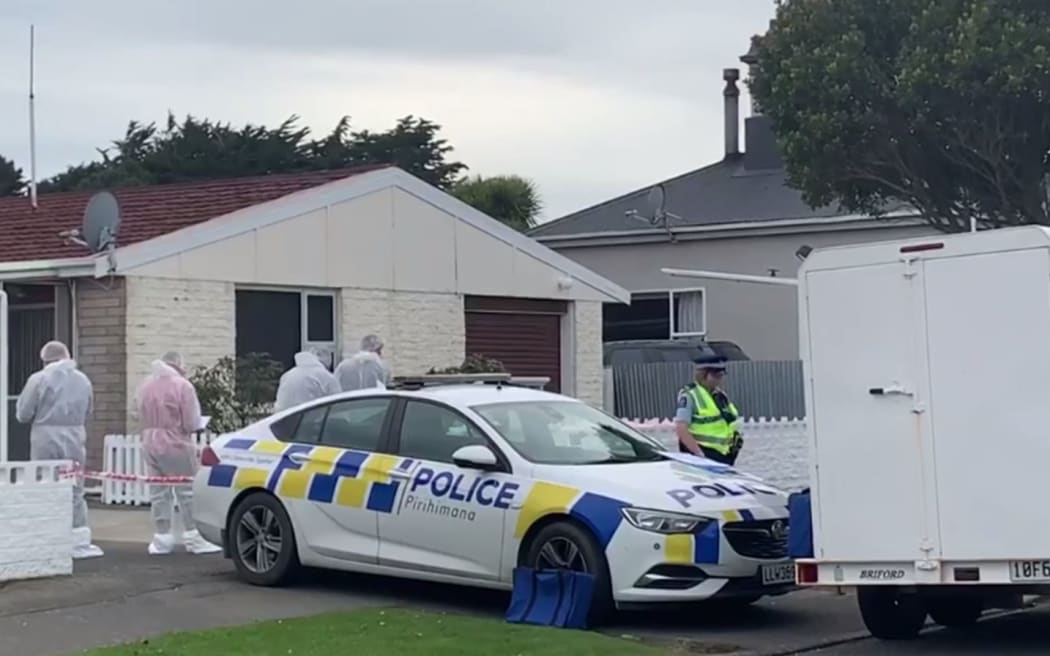 Police undertake search after woman's body found at house