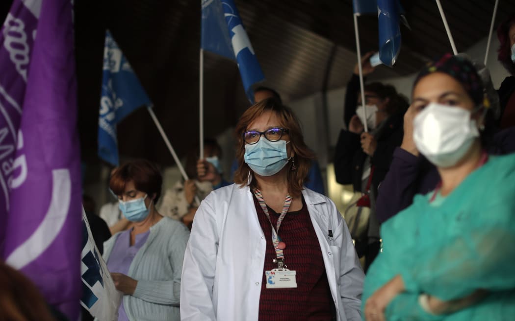 MADRID, SPAIN - OCTOBER 20: Spanish healthcare workers take part in a protest against work conditions, getting heavier due to coronavirus (COVID-19) pandemic, and privatization in the health sector in Madrid,