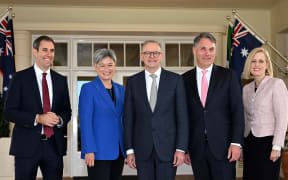 Australia's new Prime Minister Anthony Albanese poses for pictures with his new cabinet ministers, Jim Chalmers, Penny Wong, Richard Marles and Katy Gallagher after the oath taking ceremony at Government House in Canberra on 23 May, 2022.