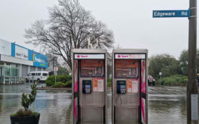 Phone booths underwater on Edgeware Road, Christchurch.