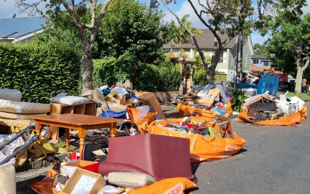 Auckland flooding - piles of rubbish on Shackleton Road in Mt Eden
