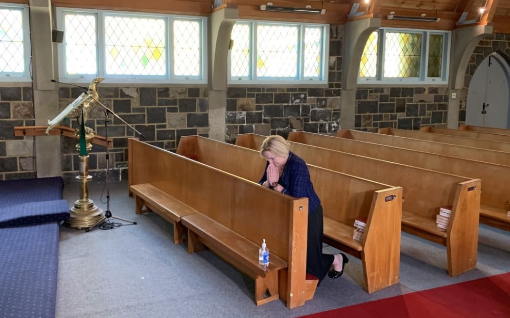 National party leader Judith Collins prays at St Thomas Church in Tāmaki before casting her early vote for the election.