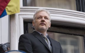 Julian Assange addresses media from the balcony of the Ecuadorian Embassy in London earlier this year