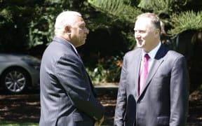 Fiji Prime Minister Frank Bainimarama and New Zealand Prime Minister John Key chat at Government House