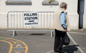 A voter arrives at a polling station in Dublin.