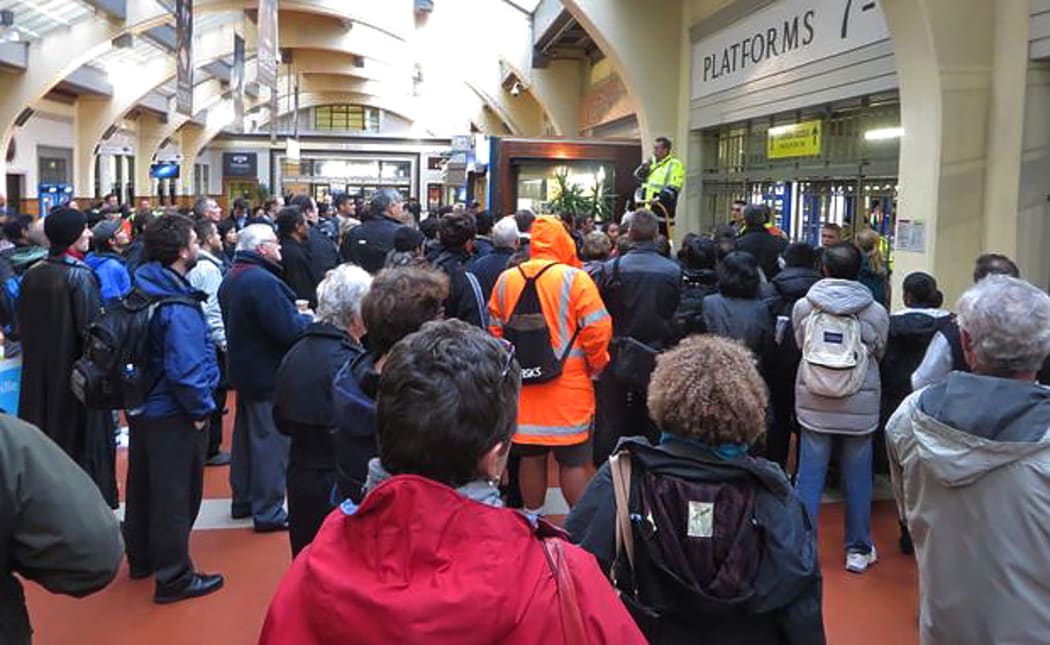 Commuters wait in vain for news at Wellington Railway Station.