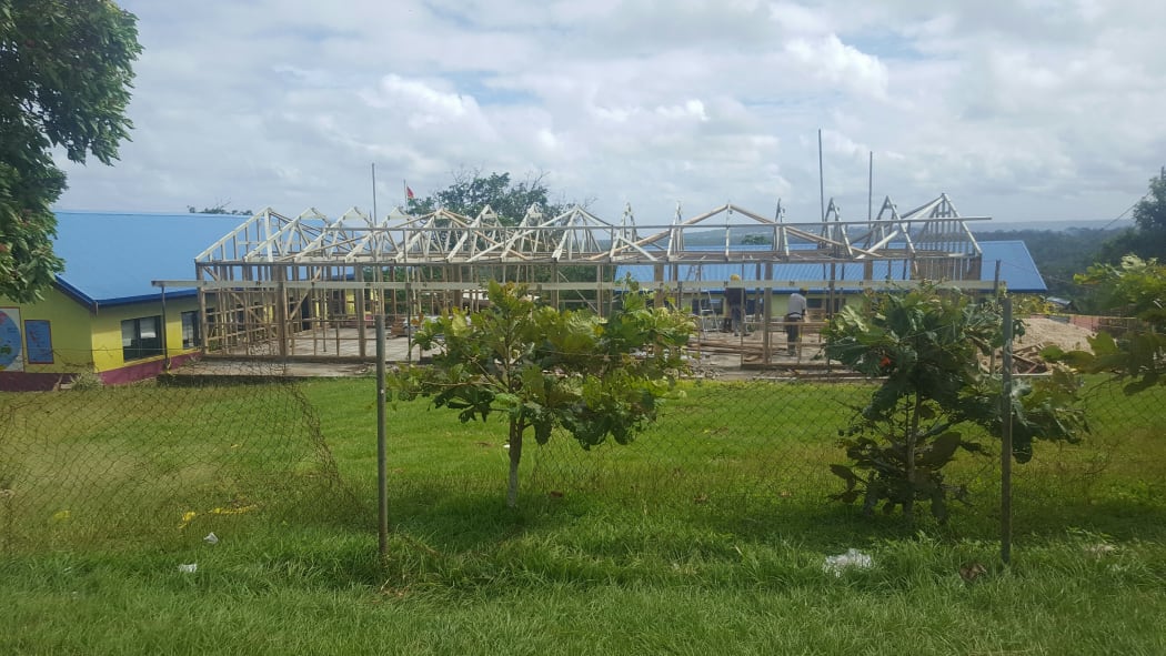 The tiny village of Eratap, south of Port Vila, was flattened in Cyclone Pam - the homes have now been rebuilt, but the school is still just wood framing.