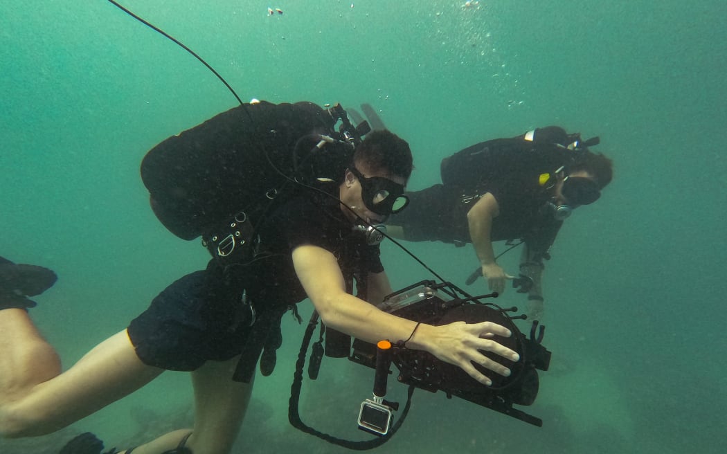 Naval Divers searching for bombs at Nanumea in Tuvalu