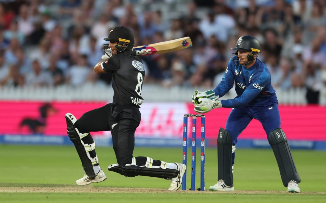 Rachin Ravindra of New Zealand batting Jos Buttler of England keeping wicket