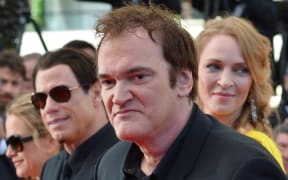 US director Quentin Tarantino arrives with actor John Travolta and Uma Thurman, pictured in 2014.
