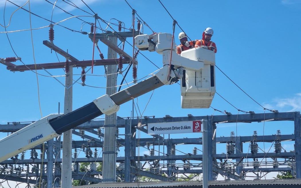 Electrical crews in hi-vis working to repair broken or damaged lines at Taradale Road switching yard.