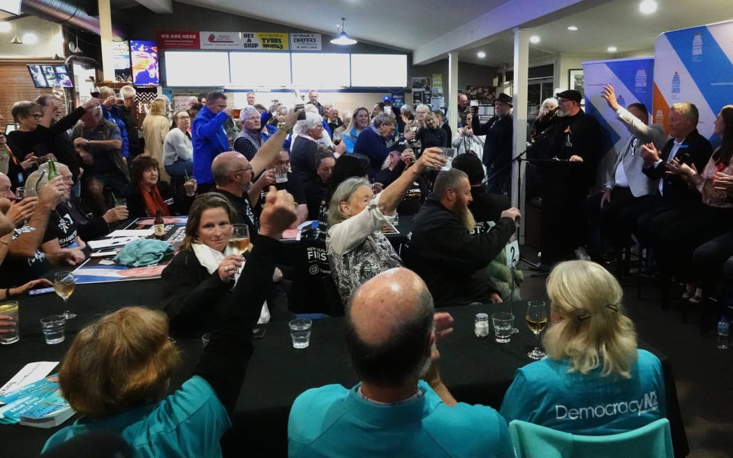 The crowd at Kerikeri's Homestead Tavern raises a toast to the upcoming election.