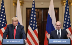 Russian President Vladimir Putin and US President Donald Trump, left, during the joint news conference following their meeting in Helsinki.