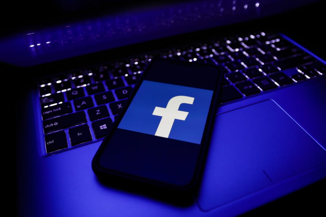 Facebook logo is seen displayed on a phone screen in this illustration photo taken in November 2020