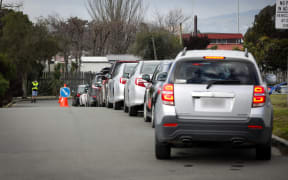 Cars lining up outside a drive through testing station, Pages Road, Christchurch.
