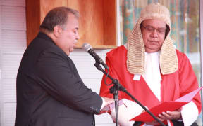 Nauru Chief Justice Ratu Joni Madraiwiwi (right) swears in President Baron Waqa (left) in July 2016.