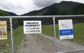private property and access sign hang on same gate