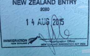 An image of a stamp in a passport, confirming residency in New Zealand.