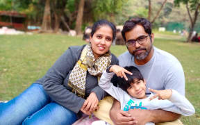 Masthan Pathana, right, with wife Afza and their son Affu, now 7 years old.