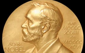 The Nobel Prize medal, which is an annual award for outstanding contributions for humanity in chemistry, literature, peace, physics, physiology or medicine