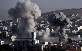 Smoke from US-led airstrikes on Islamic State militants in Kobane which has been a battleground for IS and Kurds for three weeks.