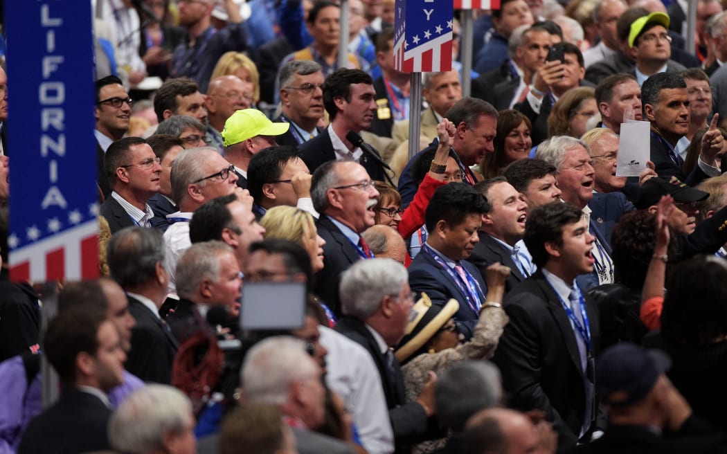 Delegates at the Republican convention react to a proposal for a rules committee vote.