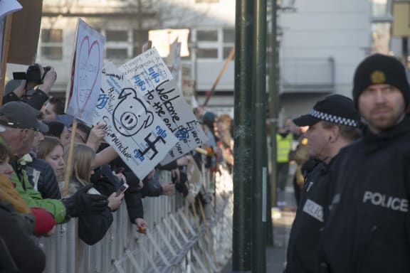 Police stand by as people protest against Iceland’s Prime Minister Sigmundur David Gunnlaugsson outside parliament in Reykjavik, Iceland on 4 April 2016.