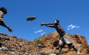 A boy working in an open pit gold mine in Mongwalu, Democratic Republic of Congo, in 2008.