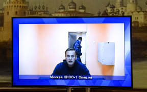 Opposition leader Alexei Navalny appears on a screen at the Moscow Regional Court via a video link from a Moscow prison.