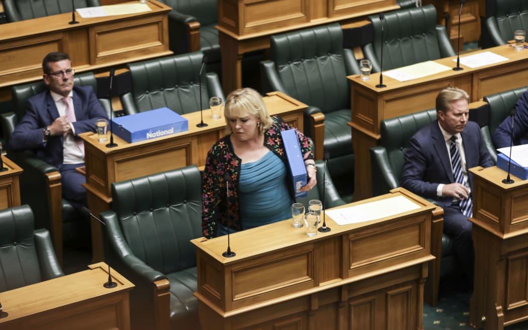 Judith Collins walks out of the House in protest at the Speaker's ejection of Simon Bridges and Gerry Brownlee.