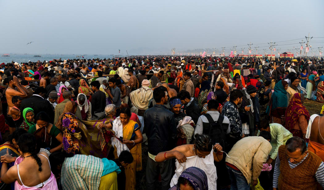 Devotees gather to take a dip on the banks of the Triveni Sangam, the confluence of the Ganges, Yamuna and mythical Saraswati rivers.